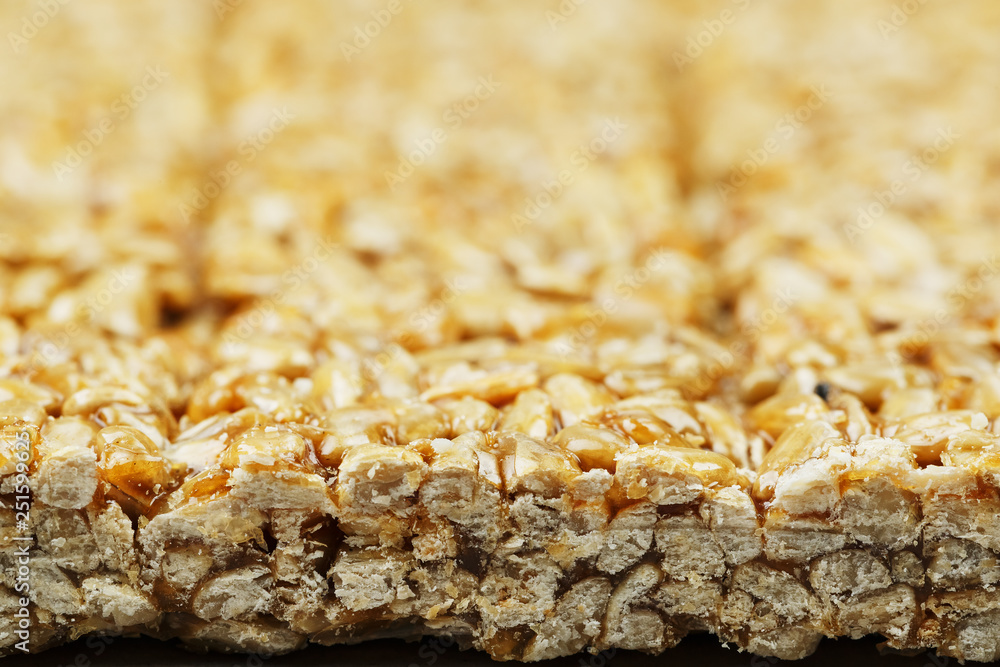 Kozinaki from golden, roasted sunflower seeds as a background, texture. Macro shooting, Kozinaki from golden, roasted sunflower seeds as a background, texture. Macro shooting,