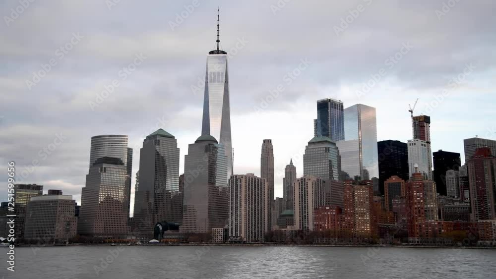 Hudson river and Downtown Manhattan skyline at sunset, view from a moving cruise ship