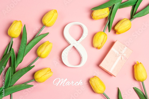 International Women's Day background with tulip flowers on pink.