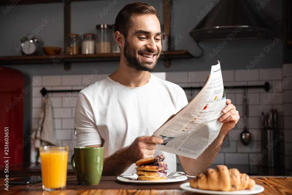 Smiling man having breakfast
