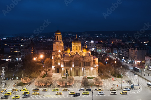 Varna, Bulgaria, January, 2019. Illuminated Cathedral late in the evening from a height shot by the drone. Tourist facility. Architectural orthodox monument. Taxi stand