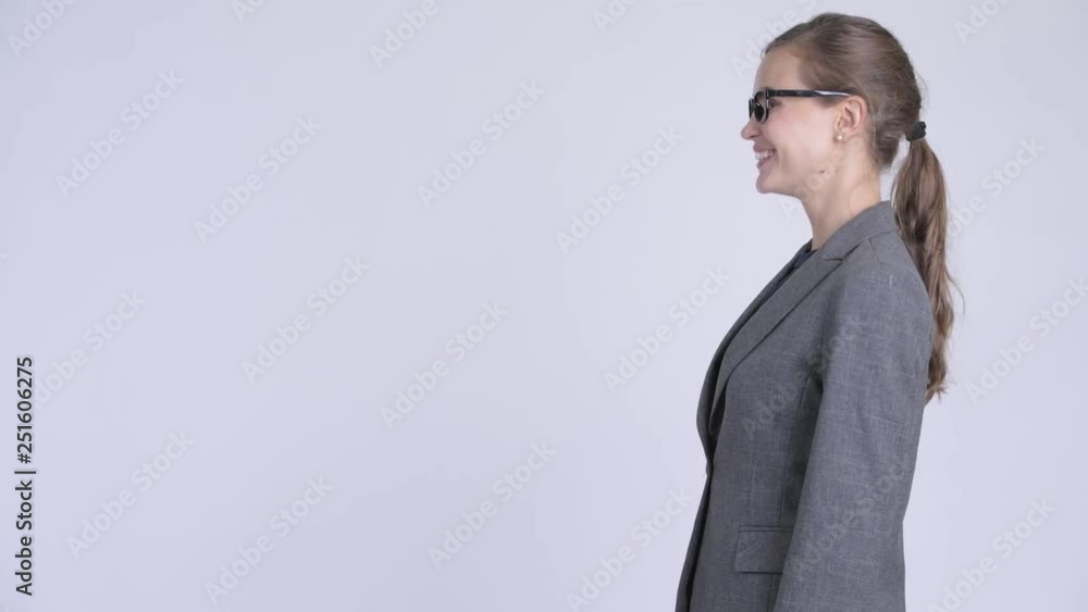 Profile view of young happy businesswoman smiling and laughing Profile view of young happy businesswoman smiling and laughing