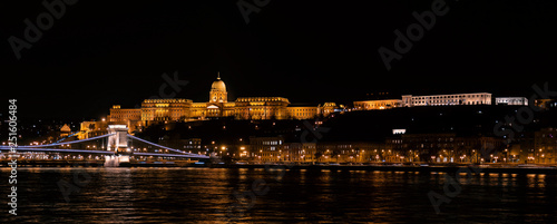 Panoramic landscape of Budapest with the Chain Bridge, Buda Castle, Presidental Palace and the Carmelite Monastery by night