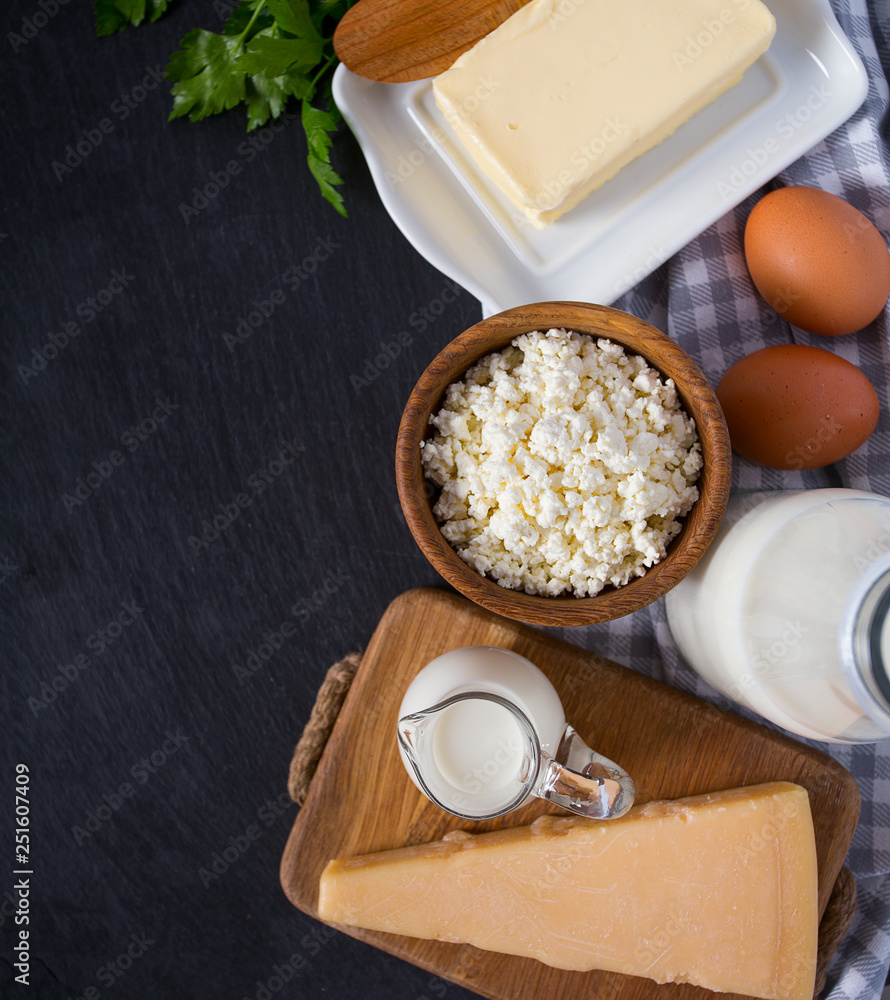 dairy products on black surface dairy products on black surface