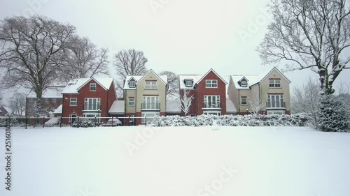 Suburban winter scene, snowfall