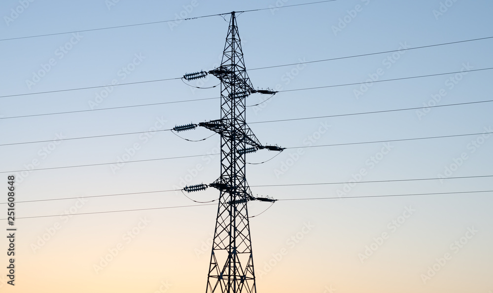 Silhouette of electricity pylon against blue sky at sunset. Silhouette of electricity pylon against blue sky at sunset.