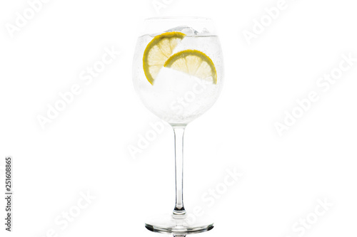 Gin based cocktail in wine glass isolated on white background. Selective focus. Shallow depth of field.