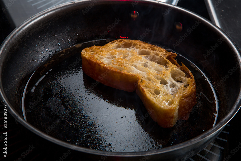 the toast is fried in butter in a pan the toast is fried in butter in a pan