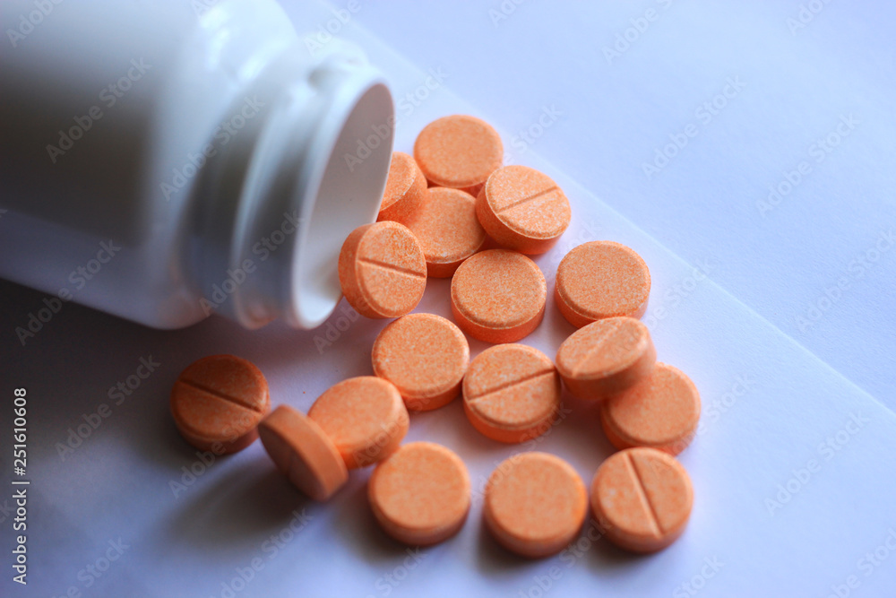 Orange tablets of vitamin C with a dosage of 500 milligrams. Stock Photo Adobe Stock