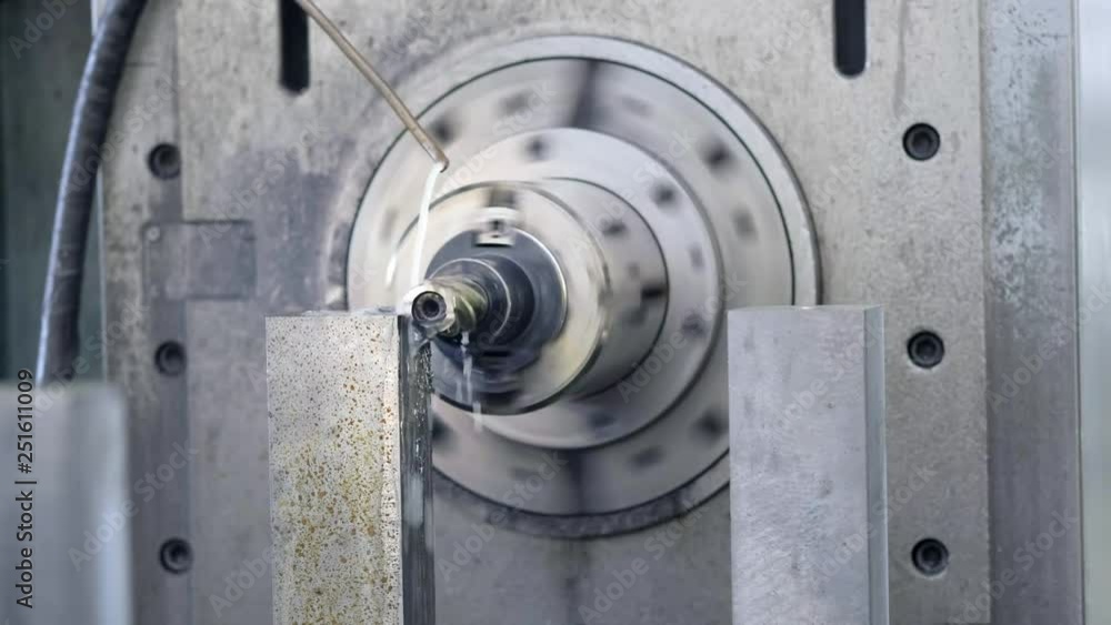 CNC Milling Machine Produces Metal Detail on Factory. Metalworking machine. Removes a layer of metal. CNC Milling Machine Produces Metal Detail on Factory. Metalworking machine. Removes a layer of metal.