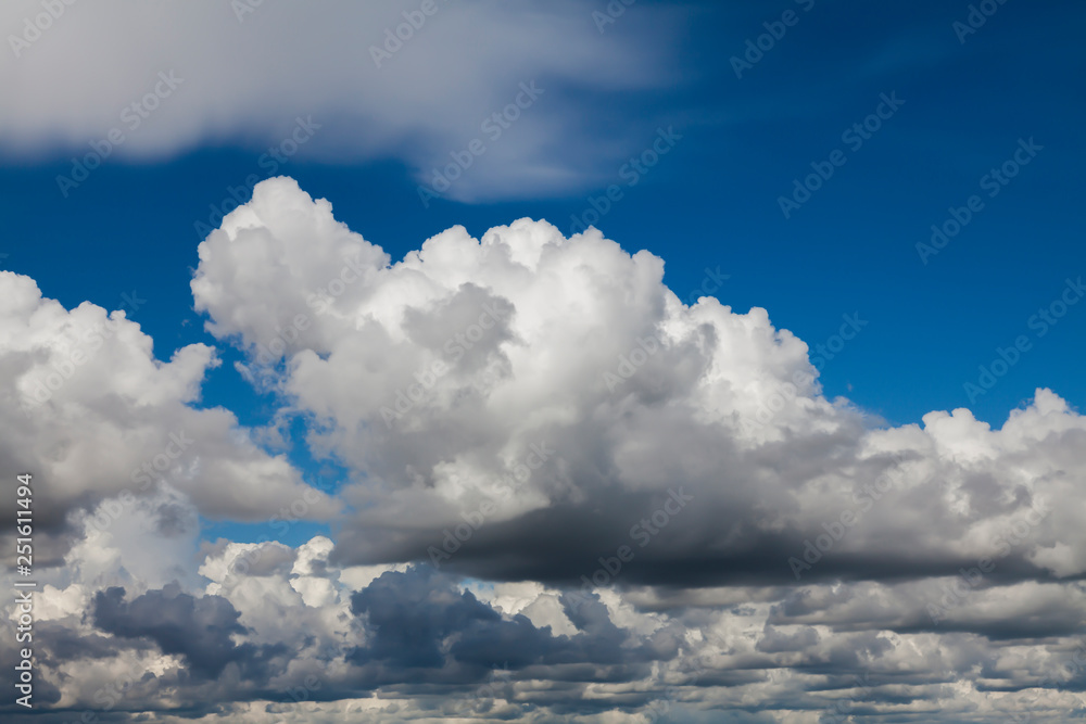 Naklejka premium Blue sky in white clouds