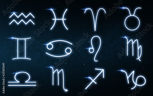 Fotografie astrology and horoscope - set of zodiac signs over dark night sky with stars bac