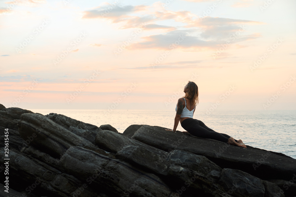 Woman Practicing Yoga in the Nature. Meditating Outdoors Woman Practicing Yoga in the Nature. Meditating Outdoors