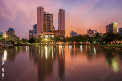 Bangkok business district with the public park area in the foreground at sunset time © funfunphoto