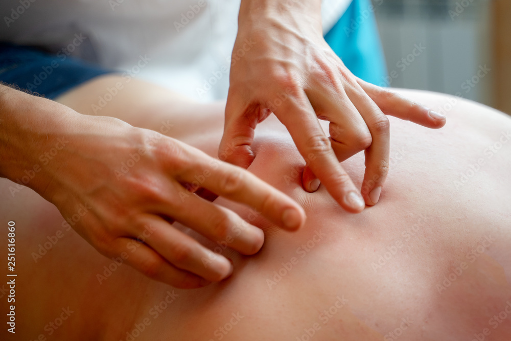 Photo from above of hands of man massaging woman. Photo from above of hands of man massaging woman.