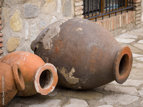 Qvevri (kvevri), a large earthenware vessel originally from Georgia, Caucasus, used for the fermentation and storage of wine, often buried below ground level or set into the floors of wine cellars. photo