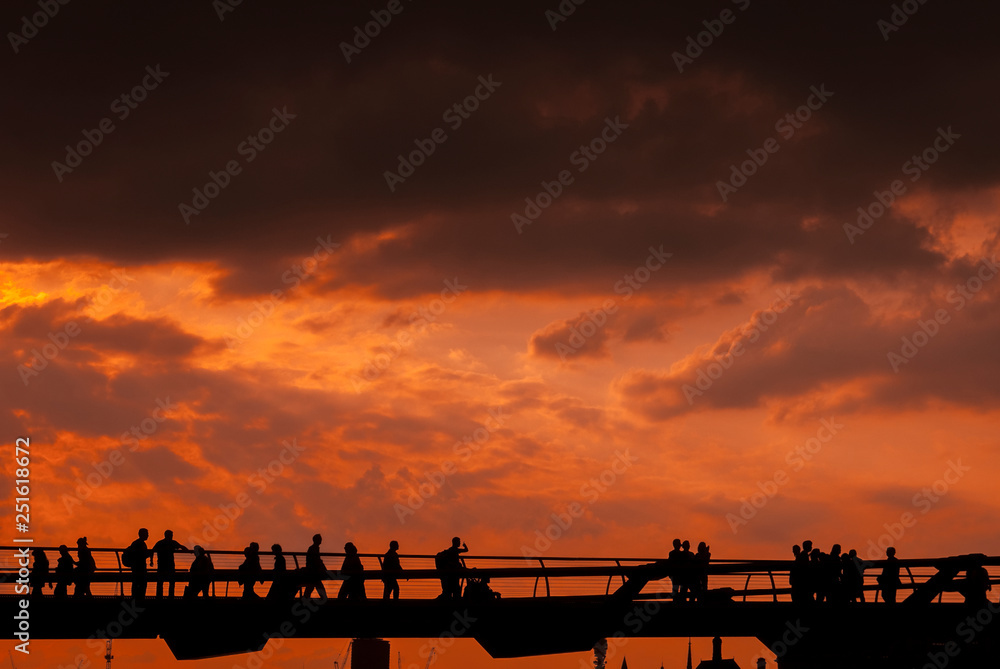 Sunset over the Millennium Bridge, River Thames, London, Britain. . Sunset over the Millennium Bridge, River Thames, London, Britain. .