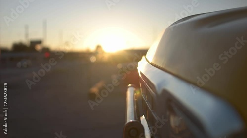 Vintage car grill with sunrise