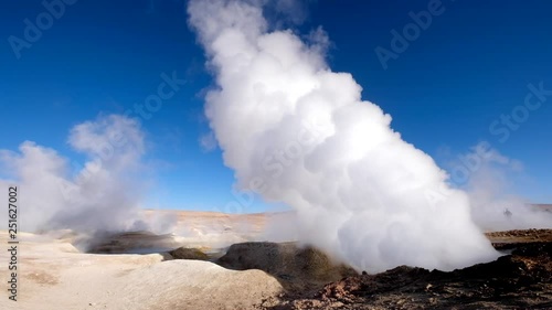 Sunshine rocky steaming geysers area in Bolivia photo