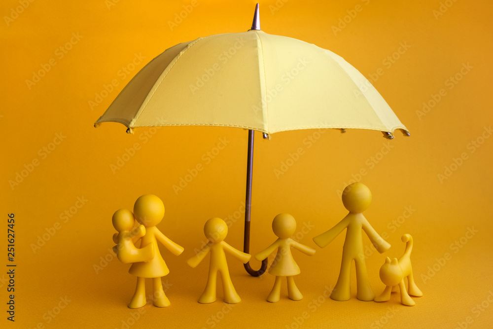 Yellow family figure with umbrella on yellow background