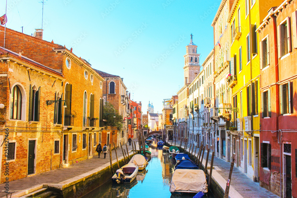 Sunny day in Venice. Narrow streets, canals and beautiful architecture.