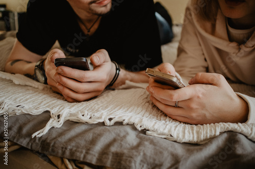 Close up of couple using cell phone