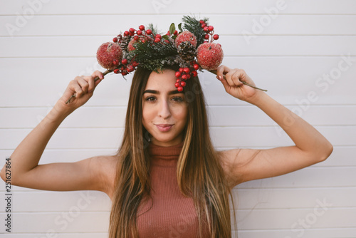Portrait of young woman holding decoration