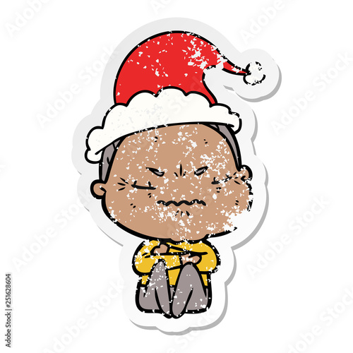 distressed sticker cartoon of a annoyed old lady wearing santa hat