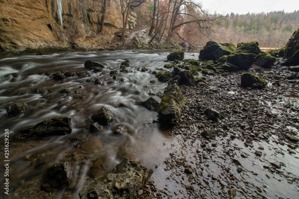 river Rak flowing over stones in Rakov Škocjan river Rak flowing over stones in Rakov Škocjan