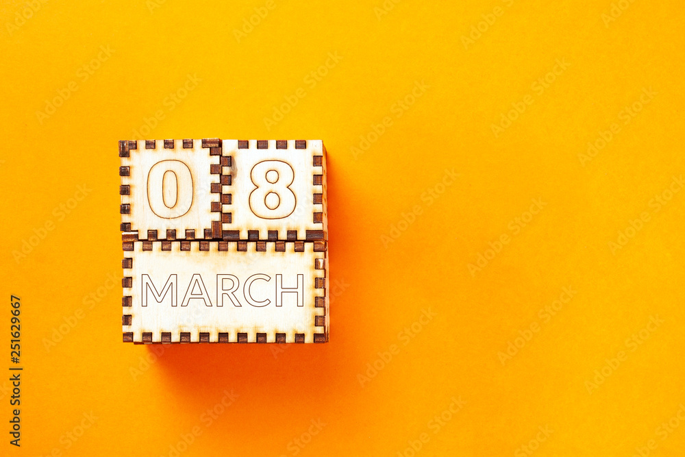 wooden cubes with the inscription March 8 on orange background. 8 march and women day concept wooden cubes with the inscription March 8 on orange background. 8 march and women day concept