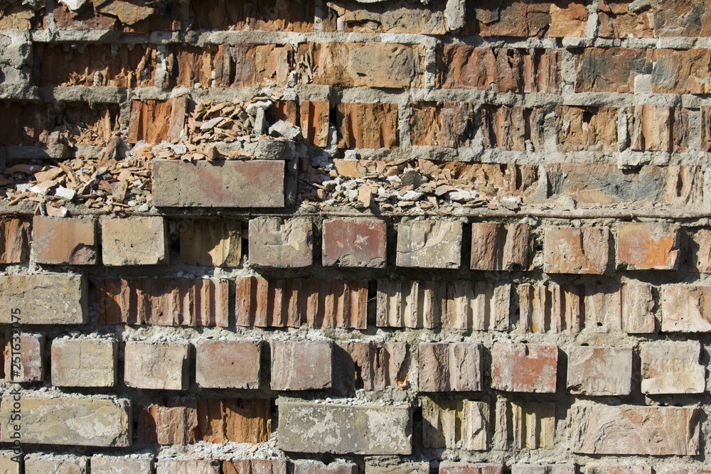  crumbling brick wall