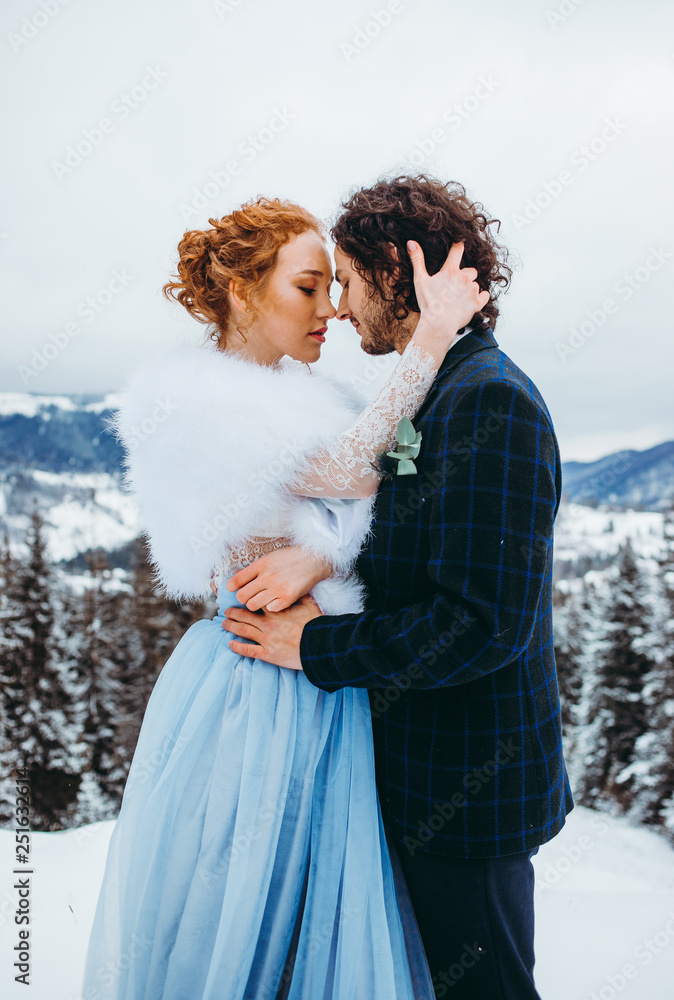 Amazing couple in winter forest. Long-awaited meeting of two lovers. Winter. Amazing couple in winter forest. Long-awaited meeting of two lovers. Winter.