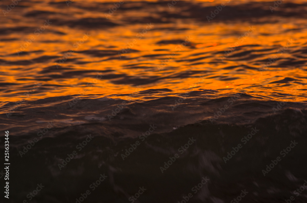 Fototapeta premium Amazing sea sunset, the sun, waves, clouds