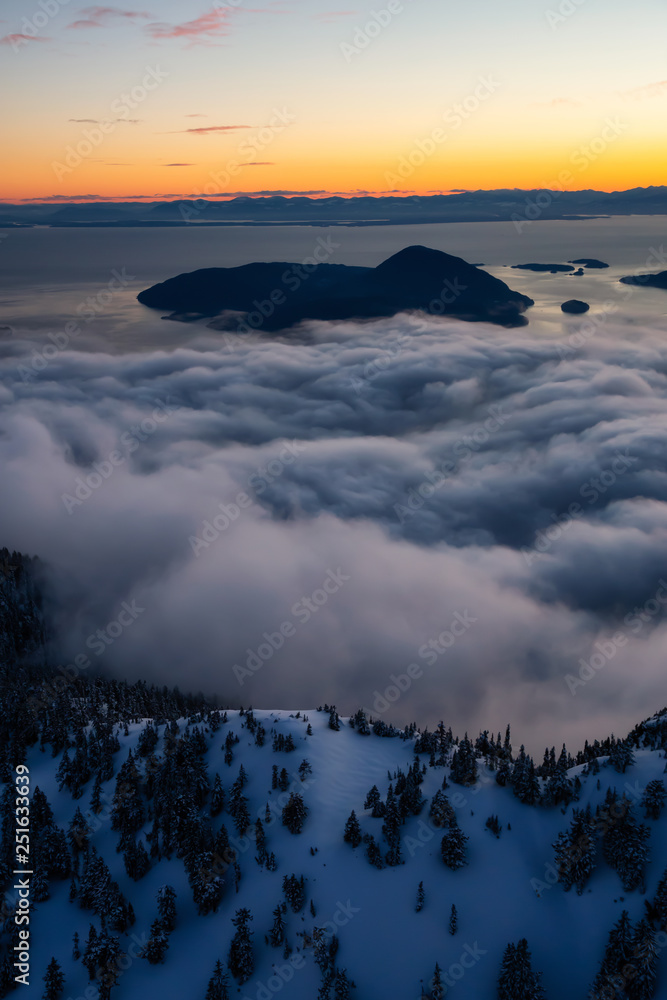 Aerial view of a beautiful Canadian Landscape during a winter sunset. Taken in Howe Sound, North of Vancouver, British Columbia, Canada.