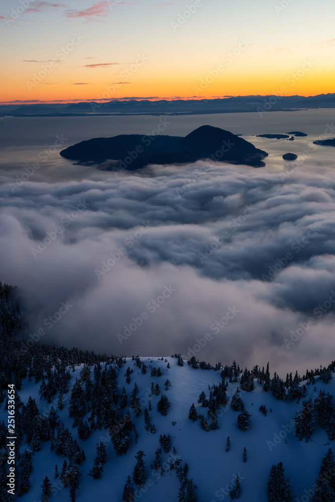 Aerial view of a beautiful Canadian Landscape during a winter sunset. Taken in Howe Sound, North of Vancouver, British Columbia, Canada.