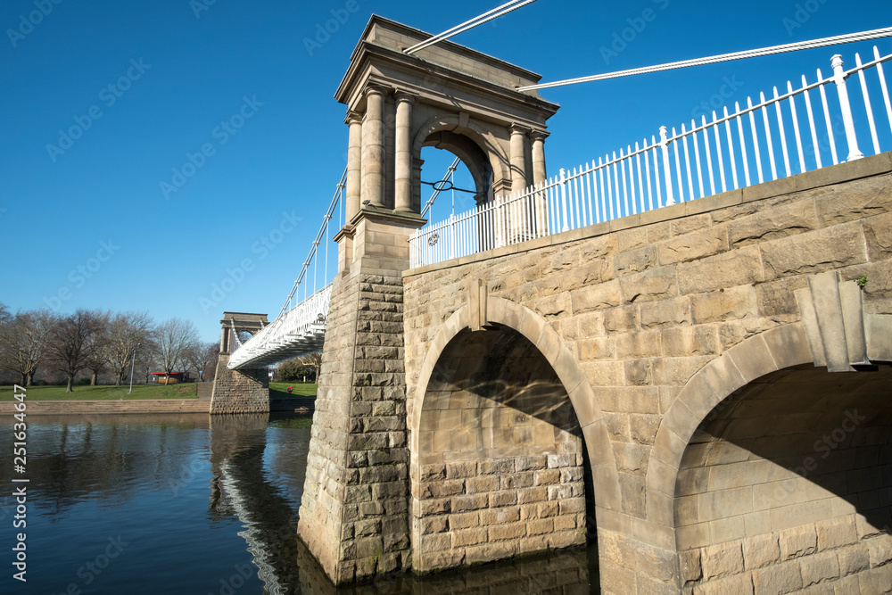 Old pedestrian footbridge spanning the river Trent in Nottingham, UK