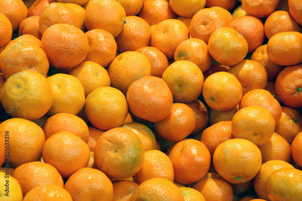 orange background of fresh tangerines orange background of fresh tangerines