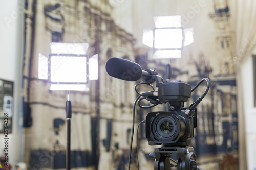 Shooting a report in the interior. Video equipment: camera, on-camera microphone gun, led lighting device, tripod.