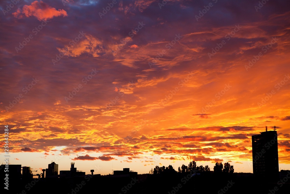 City sunset sky - dramatic view in orange color