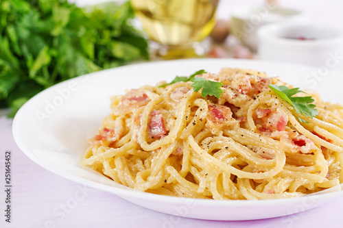 Classic homemade carbonara pasta with pancetta, egg, hard parmesan cheese and cream sauce. Italian cuisine. Spaghetti alla carbonara.
