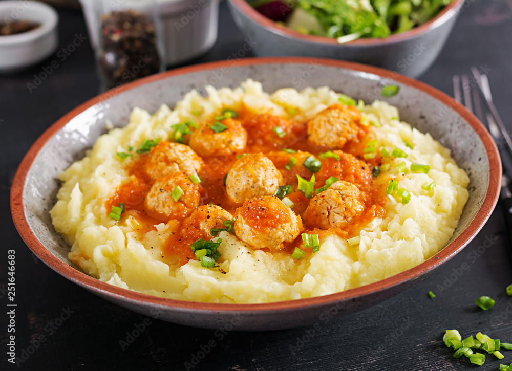 Meatballs in tomato sauce with mashed potatoes in bowl. Meatballs in tomato sauce with mashed potatoes in bowl.