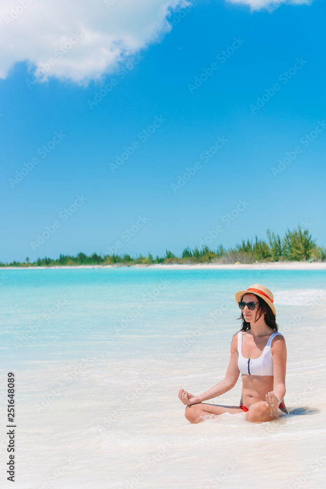 Young beautiful woman on beach vacation on Caribs