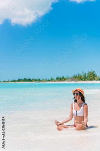 Young beautiful woman on beach vacation on Caribs