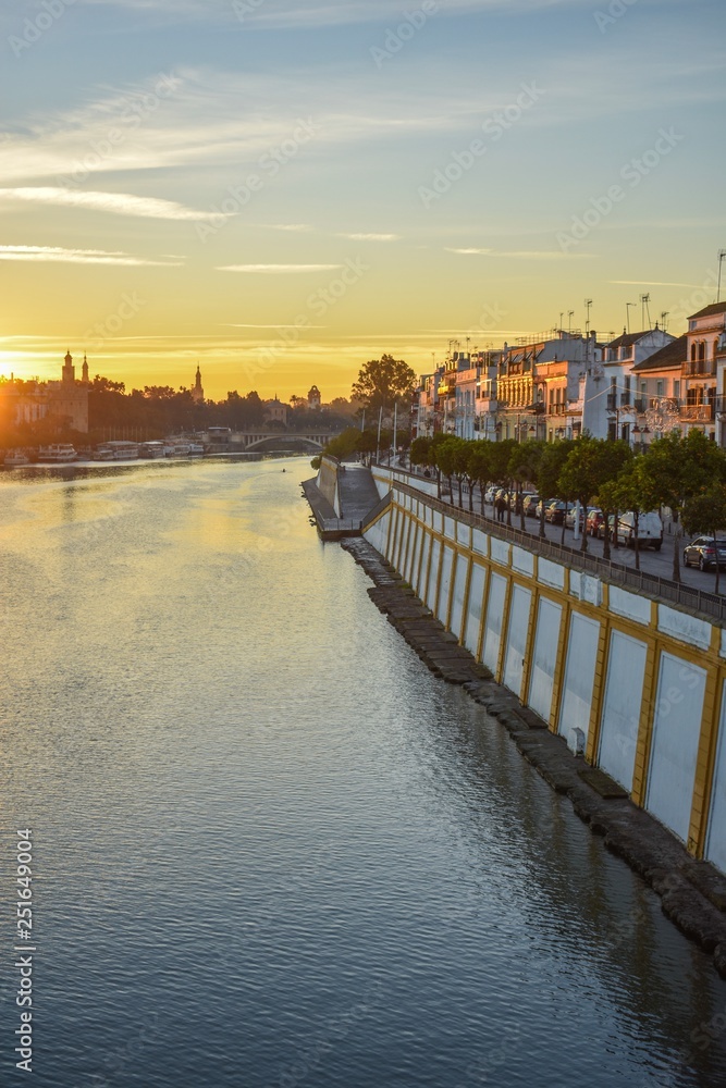 The Guadalquivir river that flows through Seville in the south of Spain, being transformed by the light of the rising sun.