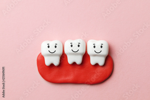 Healthy white teeth are smiling on pink background