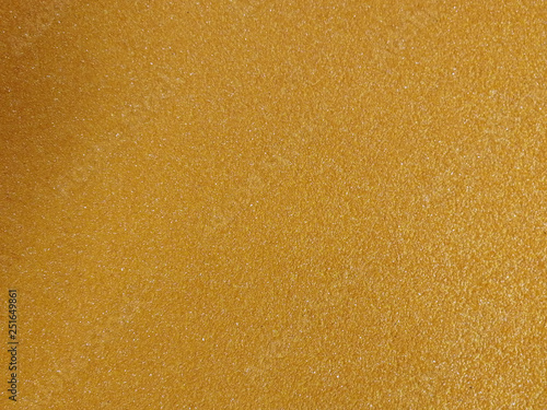 Yellow-orange gradient background with small diamond grit