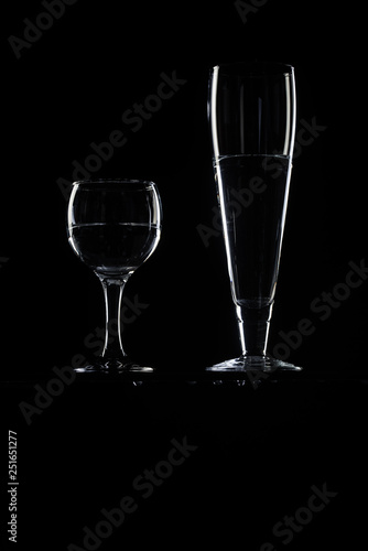 set of transparent glasses on black background 