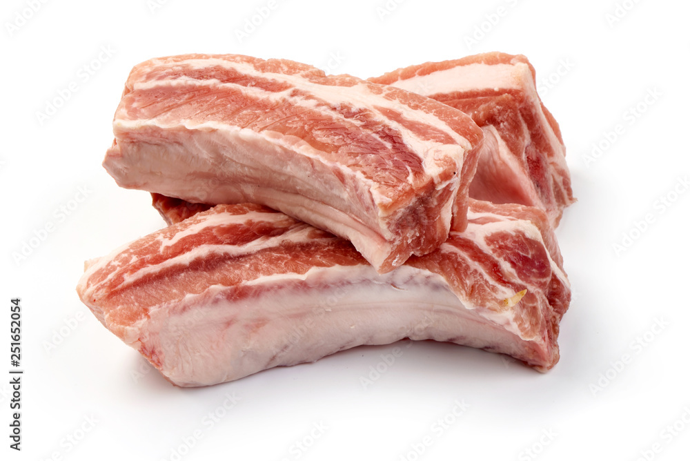 Raw fresh pork ribs, close-up, isolated on white background