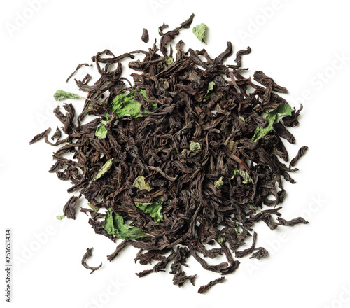 Black tea with mint leaves on white background. Top view. Close up. High resolution