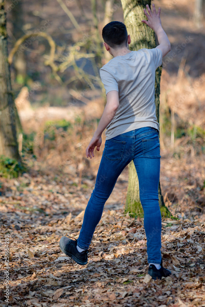 Teenage boy outside on a bright Spring day Teenage boy outside on a bright Spring day